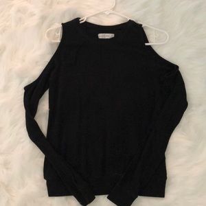 Long sleeve shirt with cutouts.